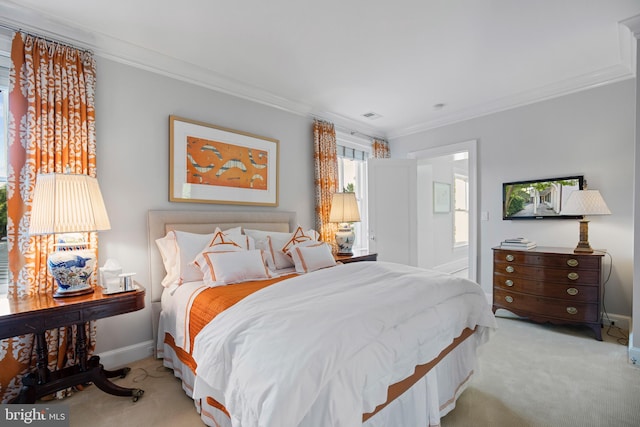 carpeted bedroom featuring ornamental molding