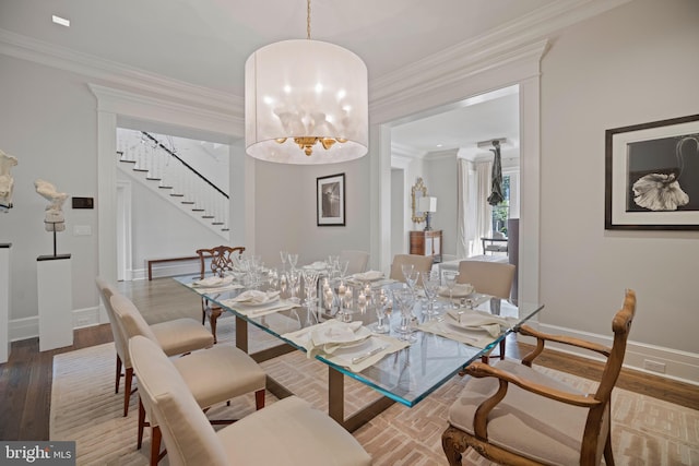 dining space featuring hardwood / wood-style flooring and ornamental molding