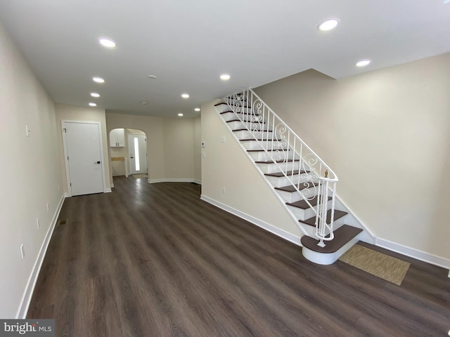 interior space with dark hardwood / wood-style floors