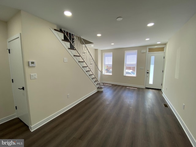 entryway featuring dark wood-type flooring