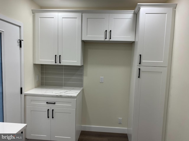 laundry room featuring dark hardwood / wood-style floors