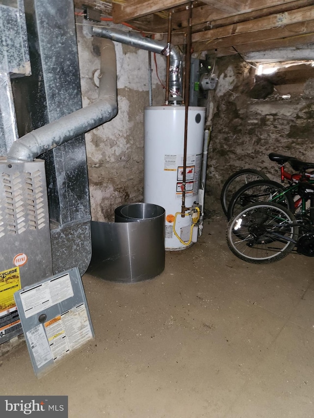 utility room featuring gas water heater