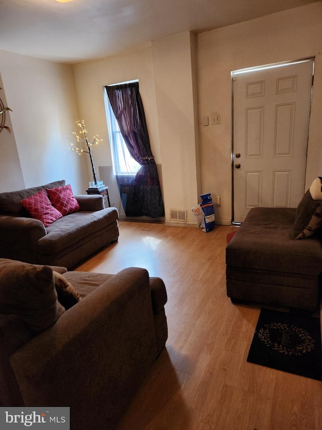 living room with light hardwood / wood-style floors