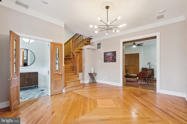 interior space featuring ceiling fan with notable chandelier, parquet floors, and crown molding