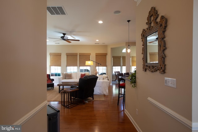 hallway with dark hardwood / wood-style flooring