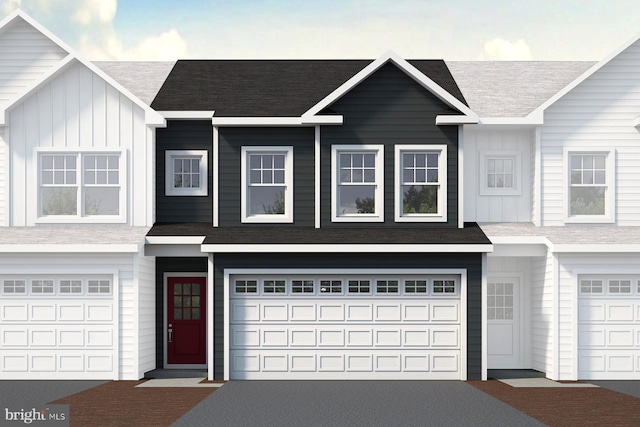 townhome / multi-family property featuring a garage