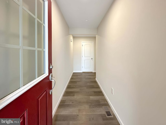 hallway featuring hardwood / wood-style flooring