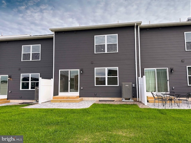 back of house featuring a yard and a patio area