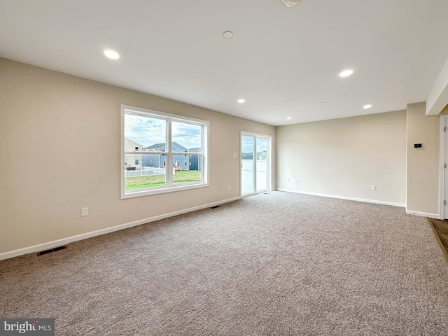 spare room featuring carpet flooring