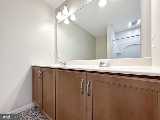 bathroom with vanity and tile patterned floors