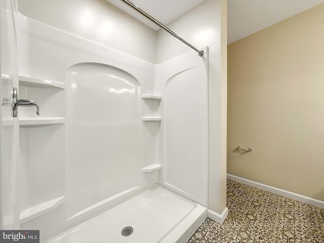 bathroom featuring tile patterned floors and a shower