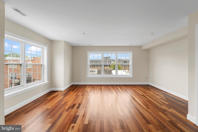 spare room with dark wood-type flooring