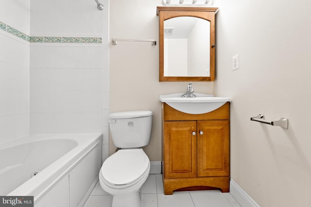 full bathroom featuring tiled shower / bath, toilet, tile floors, and vanity