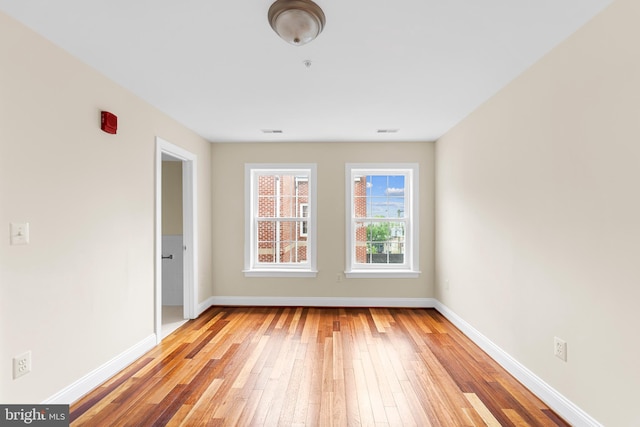 unfurnished room featuring light wood-type flooring