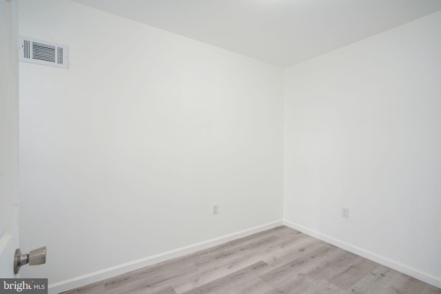 unfurnished room featuring light hardwood / wood-style floors