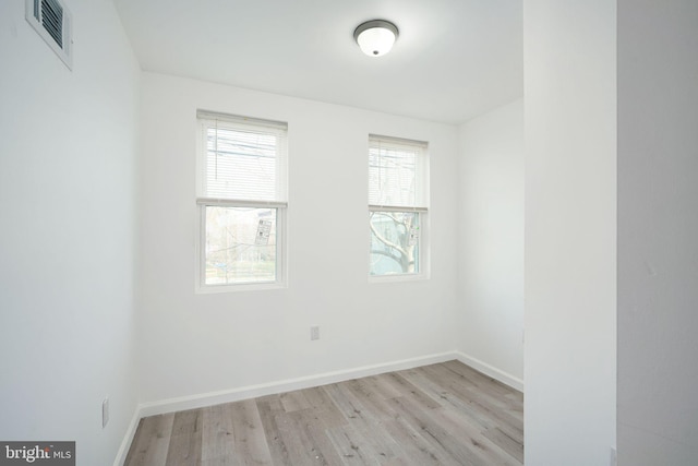 unfurnished room featuring light wood-type flooring