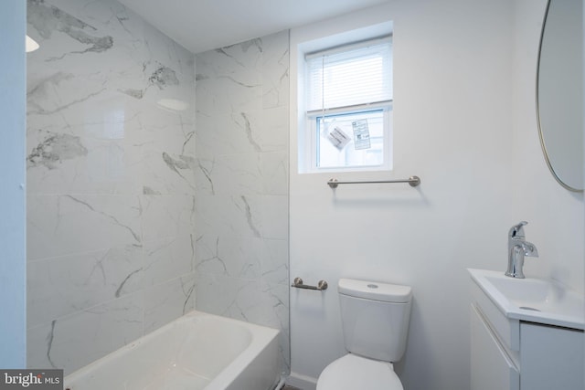 full bathroom featuring tiled shower / bath, toilet, and vanity with extensive cabinet space