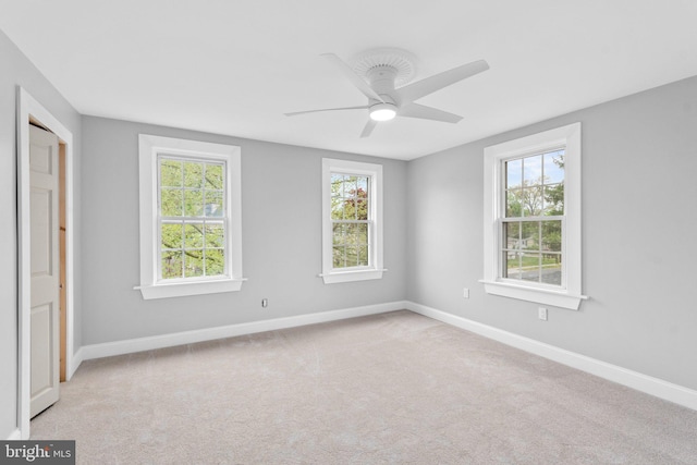 carpeted empty room with ceiling fan