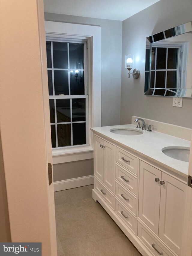 bathroom with tile patterned floors and vanity