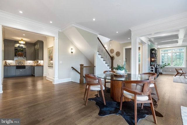 dining area featuring ornamental molding, coffered ceiling, dark wood-type flooring, and beamed ceiling