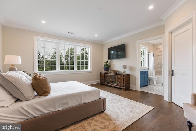 bedroom featuring ensuite bath, crown molding, and dark hardwood / wood-style flooring