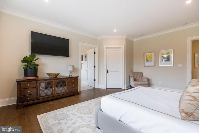 bedroom featuring ornamental molding and dark hardwood / wood-style floors