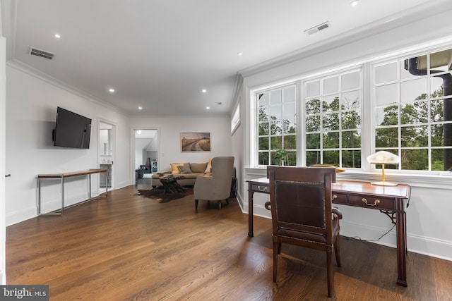 home office featuring crown molding, wood-type flooring, and a healthy amount of sunlight