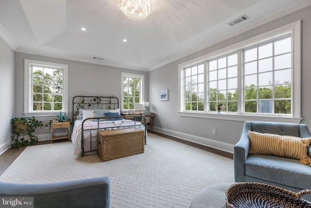 bedroom featuring a notable chandelier, multiple windows, and ornamental molding