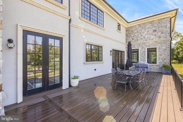 wooden deck featuring french doors and grilling area