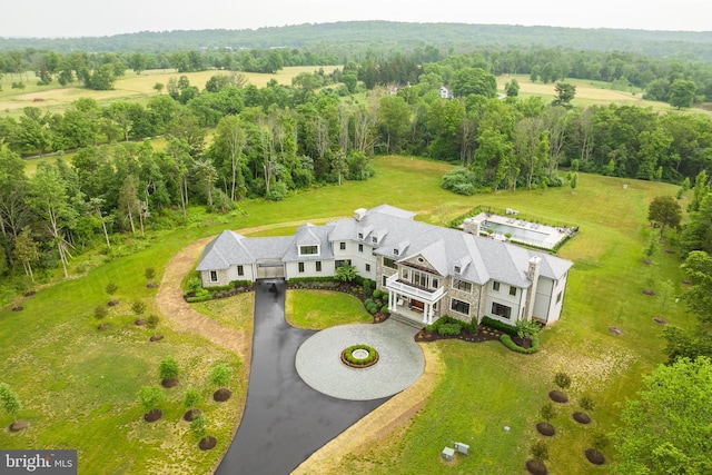 birds eye view of property with a rural view