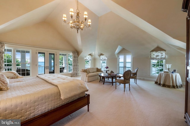 bedroom featuring carpet flooring, multiple windows, and an inviting chandelier