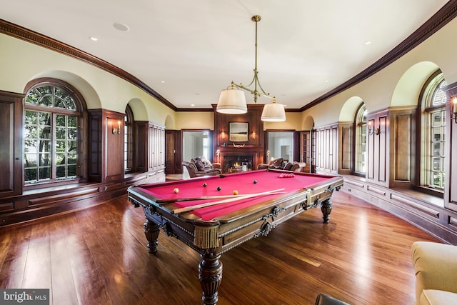 playroom featuring a fireplace, crown molding, hardwood / wood-style floors, and pool table