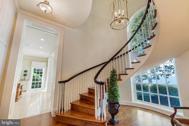 entryway featuring a chandelier and hardwood / wood-style floors