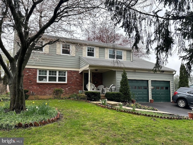 view of property with a porch, a front lawn, and a garage