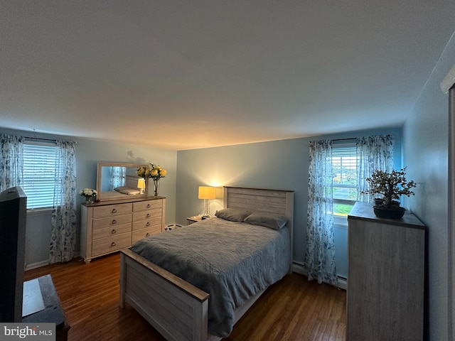 bedroom with dark wood-type flooring