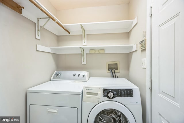 laundry room with washer and dryer