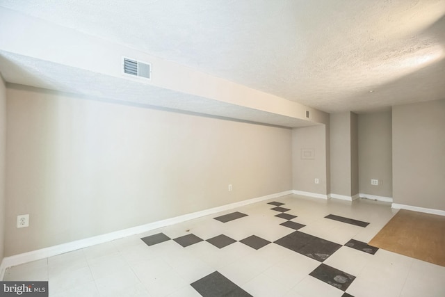 basement with a textured ceiling