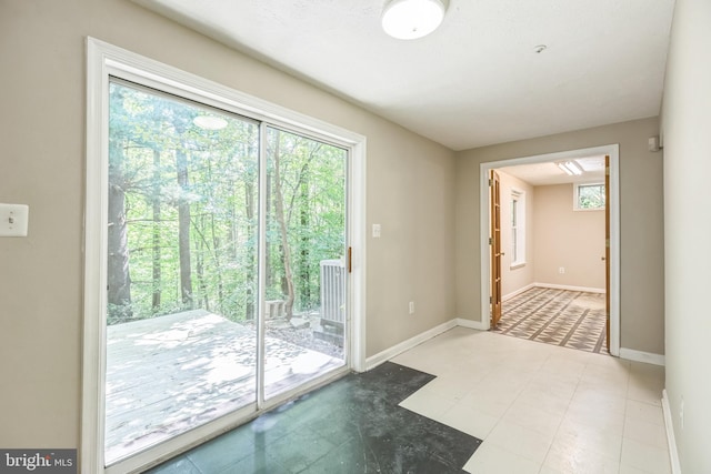 doorway to outside with plenty of natural light