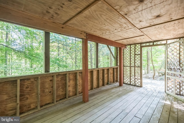 unfurnished sunroom featuring a healthy amount of sunlight