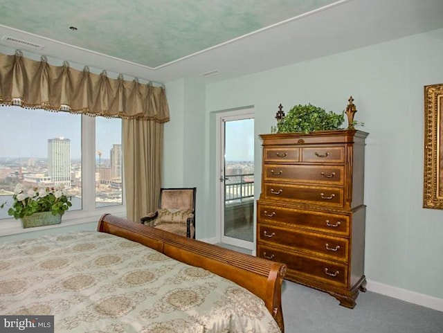 carpeted bedroom with access to outside