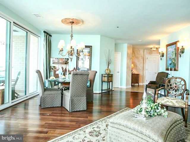 interior space featuring dark hardwood / wood-style flooring and a chandelier