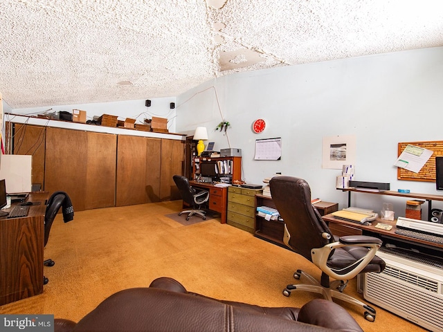 carpeted home office featuring lofted ceiling and a textured ceiling