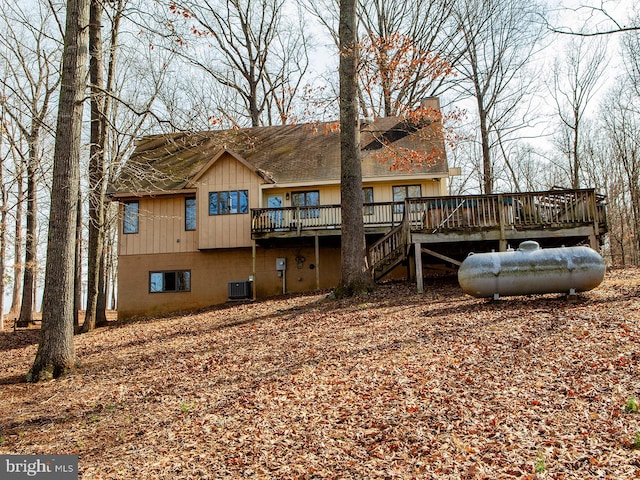 back of house featuring stairway, cooling unit, and a deck