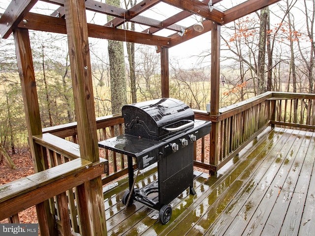 wooden deck featuring area for grilling