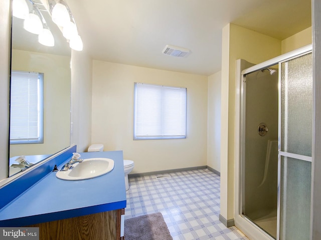 bathroom featuring visible vents, baseboards, tile patterned floors, vanity, and a shower stall