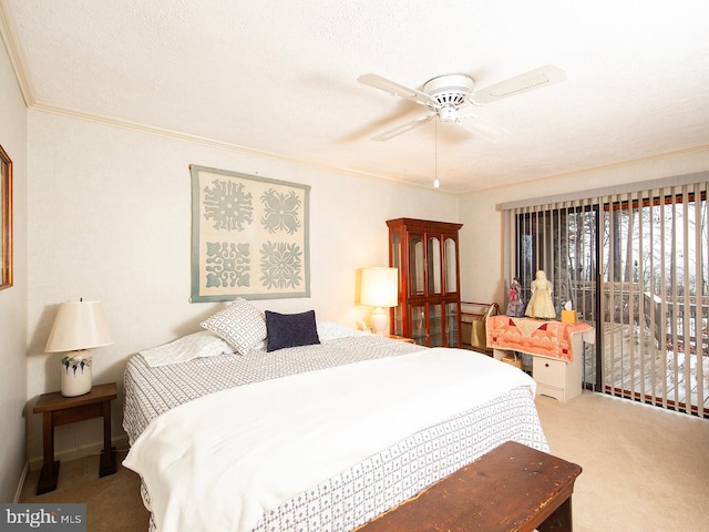 bedroom featuring carpet floors, ceiling fan, and crown molding