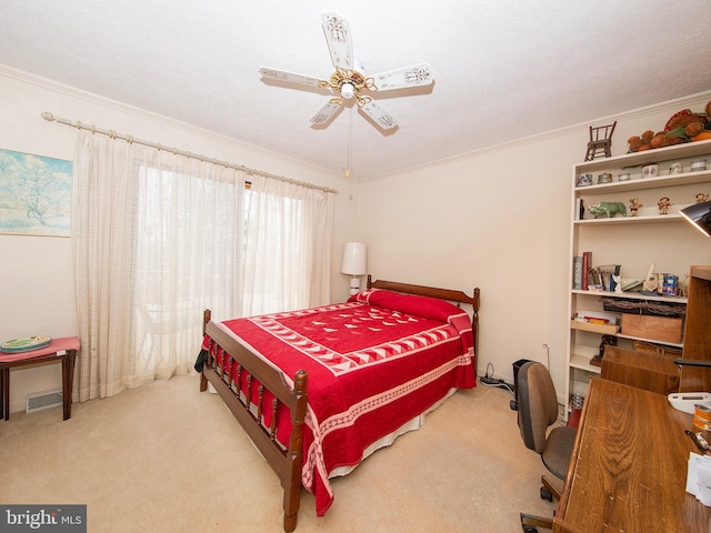 bedroom with visible vents, ceiling fan, carpet, a textured ceiling, and crown molding