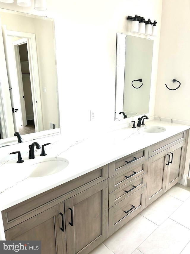 bathroom featuring tile floors and double sink vanity