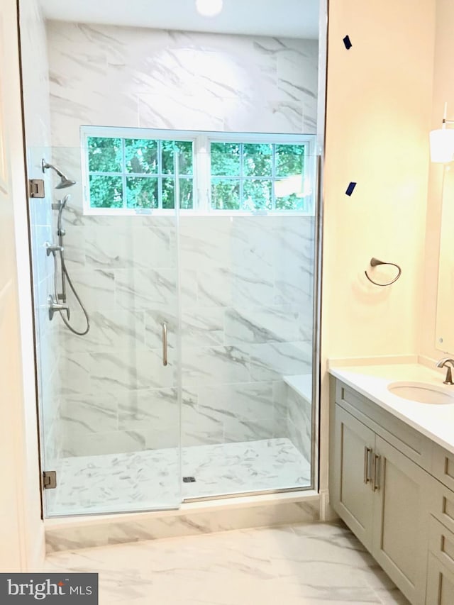 bathroom with vanity, tile floors, and walk in shower