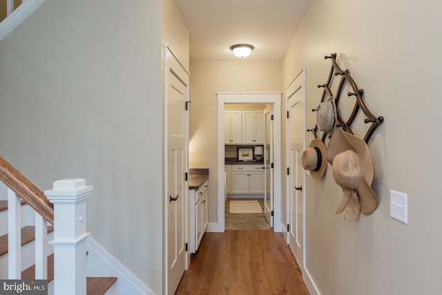 corridor featuring hardwood / wood-style flooring